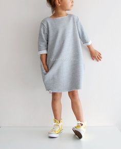 Oversized Sweater Dress for Girls My toddler sweater dress is absolutely adorable and makes the perfect addition to any wardrobe of all the little fashionistas. The sweater dress is comfortable to wear because its oversized, it has 2 big pocket and your little girl will look trendy Girls Long Sleeve Dress Pattern, Oversize Sweater Pattern, Toddler Sweater Dress, Long Sleeve Dress Pattern, Long Sweatshirt Dress, Girls Sweatshirt Dress, Sweater Dress Pattern, Oversized Sweater Dress, Big Sweater