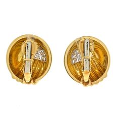 These stunning and bold David Webb Diamond Dome Round Clip On Earrings are made in 18k yellow gold and platinum. Accented with round cut diamond as accented. Finished with signature David Webb hammered finish, fastens with a heavy clip. Center Diamond Weight: 0.00Measurements: 22mm wideMetal Type: Platinum & 18K Yellow GoldMetal Weight: 33.5 gr.Signed: WEBBCondition: Excellent.Stock: RR8463 Designer Gold Diamond Earrings, Designer Yellow Gold Clip-on Earrings For Anniversary, Formal Designer Diamond Earrings In Yellow Gold, Designer Yellow Gold Diamond Earrings, Designer Yellow Gold Diamond Earrings For Formal Occasions, Designer Gold Diamond Earrings For Anniversary, Formal Designer Yellow Gold Diamond Earrings, Designer Diamond Earrings In Yellow Gold, David Webb