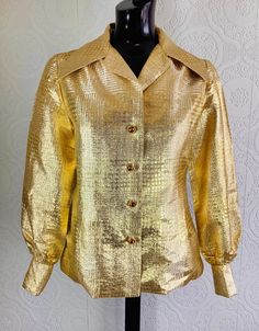 Fully lined light weight gold coloured jacket. Amber coloured button front and cuff closure.  Bust- 36 inches Waist-34 inches  Top of shoulder to hem-22.5 inches  Underarm to sleeve end-16.5 inches