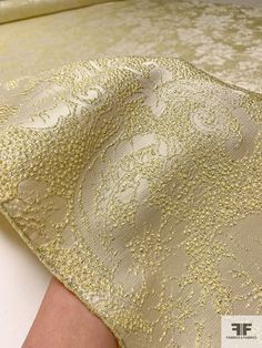 This floral textured metallic brocade in light yellow, silver, and champagne is a luxurious and opulent fabric that is perfect for creating a show-stopping look. The light yellow color combined with the metallic silver and champagne threads creates a subtle and sophisticated shimmer, while the floral pattern adds a touch of romance. SKU: 16509 Content: Polyester / Lurex Color: Light Yellow / Silver / Champagne Width: 51 inches Elegant Brocade Fabric For Party, Elegant Beige Wedding Fabric, Elegant Beige Fabric For Wedding, Elegant White Festive Fabric, Elegant Jacquard Fabric For Evening, Elegant White Fabric For Festive Season, Festive Jacquard Fabric, Cream Elegant Party Fabric, Elegant Cream Fabric For Party