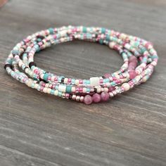 Pink Tourmaline and Mother of Pearl Mixed Seed Bead Wrap - Etsy Bohemian Wrap Bracelet With Colorful Heishi Beads, Bohemian Beaded Wrap Bracelet For Layering, Bohemian Wrap Bracelet For Layering, Bohemian Pink Wrap Bracelet For Festival, Bohemian Multi-strand Beaded Bracelets With 108 Beads, Bohemian Wrap Bracelet With Round Beads For Summer, Bohemian Beaded Stackable Bracelets, Handmade Pink Wrap Bracelet For Beach, Pink Beaded Bohemian Wrap Bracelet