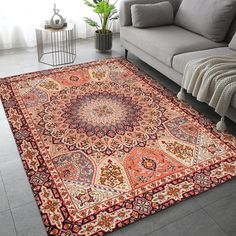 a living room with a couch and rug on the floor