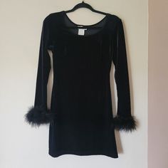 Vintage 90s Vampy Goth Punk Black Velvet Long Sleeve Mini Bodycon Dress - brand is  Stepin' Out - made from stretchy black velvet - sleeves have genuine feather cuffs - scoop neck - size small Approx flat measurements- pit to pit 16.5", waist 13.5", hips 18", sleeves 23", length 31" Very good used condition- sheds some feathers but there are still plenty left Shop Information: Worldwide shipping available. Please contact me for a shipping quote for: - orders outside of Canada/US - bundles of mor Cvnty Outfits, Feather Cuffs, Goth Clothes, Velvet Sleeve, Mini Bodycon Dress, Goth Punk, Mini Velvet Dress, 70 Dress, Womens Black Dress