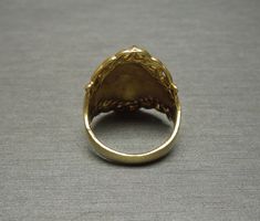 "Vintage Mid-Century Circa 1960 Constructed of Sterling Silver Accented with a Gold Plating Top section of ring measuring approximately 1\" in length --Refer to photo on finger in natural daylight-- Inside shank: 925 Finger Size 6 (Sizing upon request; Additional fees may apply) Weighing 5.9 grams *Sale of ring includes an appraisal certificate for your insurance purposes. All pieces shipped insured via USPS Priority Mail requiring signature upon delivery. Specialty gift wrap upon request at no Vintage Jewelry With Ring Detail For Formal Occasions, Vintage Formal Jewelry With Ring Detail, Vintage Gold Cluster Ring Hallmarked, Vintage Ceremonial Signet Ring With Open Design, Vintage Gold Engraved Ring, Vintage Engraved Dome Ring For Formal Occasions, Vintage Ceremonial Open Signet Ring, Estate Style Oval Gold Jewelry, Estate Style Yellow Gold Ring