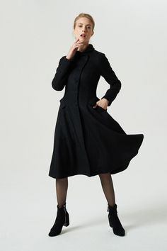 "This beautiful black coat is so feminine with its ruffled Peter Pan collar. The vintage coat make up wool blend and polyester lining,and with the fitted waist + buttoned up bodice leading into a wide flowing skirt,shows a woman's elegant figure. Flap pockets that sit right at the waist band and cuff straps are additional nice lightspot,it makes you in elegance and beauty there is loveliness in this winter. DETAIL * More color https://etsy.me/2VjpxuB * Wool composition \" 45% wool blend + fiber Knee-length Single Breasted Winter Outerwear, Fitted Wool Coat With Stand Collar For Fall, Fitted Black Wool Coat For Winter, Elegant Black Wool Sweater Coat, Chic Black Wool Coat For Winter, Elegant Black Knee-length Outerwear, Elegant Knee-length Black Outerwear, Elegant Black Wool Coat With Long Sleeves, Elegant Black Wool Coat