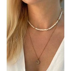 Delicate high luster mother of pearl heishi beads with 14kt gold filled accents. Individually selected high quality freshwater pearls make the necklace truly special and one of a kind. The delicate and minimalist design goes well with both casual and sophisticated looks. Total length of the necklace: 15 inches plus 1 inch chain extender. Follow the shop on INSTAGRAM: @soellejewelry Tag soelle jewelry on social media: #soellejewelry Packed with care and ready to ship! Handmade with love ♥ White Single Strand Pearl Necklace With 14k Gold Filled, Adjustable White Pearl Necklace With 14k Gold Filled, Adjustable White Pearl Necklace In 14k Gold Filled, Adjustable White 14k Gold Filled Necklaces, Adjustable White 14k Gold-filled Necklace, Gold Shell Necklace With Gemstone Beads As Gift, White Heishi Beads Single Strand Jewelry, Dainty White Beaded Necklaces With Gemstone Beads, White Pearl Necklace With 14k Gold-filled Pearl Pendant