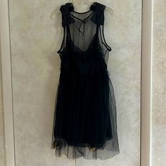 Xxo Lbd Highly Styled With Netting. Content Is Nylon And Polyester. Bows At Shoulders. Back Has Only Netting. Elastic At Waist Stretches. Length To End Of Netting Is 42”. Dress Is 4” Shorter. Armpit To Armpit 24”. Waist Stretches To 18”. Zipper On Side. Machine Wash. Perfect For A Special Occasion. Black Sheer A-line Dress, Black Sleeveless Sheer Dress, Black Sleeveless Mesh Dress For Night Out, Black Sleeveless Mesh Dress For Cocktail, Black Sleeveless Mesh Dress For Spring, Black Sheer Sleeveless Dress, Black Mesh Mini Dress For Summer, Black Sheer Mini Dress For Casual Wear, Black Knee-length Mesh Dress For Summer