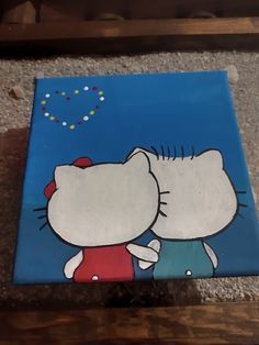 a hello kitty painting on a blue background