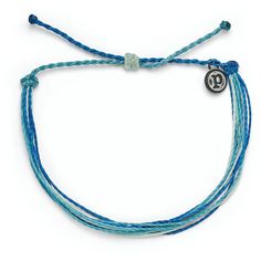 Wear this bracelet of ocean blues to feel the Pura Vida vibes. Each Good Vibes classic bracelet is handmade from waxed string cording, waterproof and totally unique. The more you wear it, the cooler it looks. The bracelet encourages the Pura Vida vibe, a philosophy to live life to the fullest. Pura Vida provides sustainable jobs to artisans worldwide who are dedicated to the "pura vida" way of life. | Pura Vida Original string bracelet in Deep Dive design. | Wax-coated polyester string cord with Puts Vida Bracelets, Blue Bohemian Friendship Bracelets For Everyday, Everyday Adjustable Ocean-inspired Jewelry, Adjustable Ocean-inspired Jewelry For Everyday, Adjustable Ocean-inspired Everyday Jewelry, Blue Resizable Braided Bracelet For Everyday, Everyday Bohemian Blue Braided Bracelets, Everyday Resizable Blue Braided Bracelets, Everyday Blue Resizable Braided Bracelets