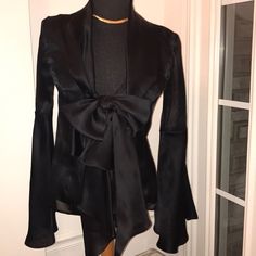 Irresistible Black Sheer Silk. Shawl Color. Low V-Neckline. One Bust-Line Button Fastening Large Bow & Hanging Ribbon Design. Long Sleeves With Dramatic Bell Design. Open Stomach Area. Incredibly Stunning Beautiful Elegant & Sexy. Euc. Made In Italy. No Snags Or Loose Seams. Immaculate Condition. A Conversation Statement. Chic V-neck Party Blazer, Designer Silk V-neck Blouse, Chic Long Sleeve Blazer For Evening, Elegant Black Top For Evening, Elegant Black Evening Top, Formal Silk V-neck Top, Elegant Long Sleeve Blazer For Date Night, Fitted V-neck Blazer For Evening, Fitted V-neck Evening Blazer