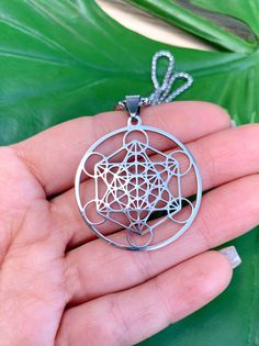 This unisex necklace honors the sacred symbol of Metatron's Cube, a sacred geometry symbol which contains all of the geometric shapes in creation and represents the patterns that make up everything. These shapes which are the building blocks of all physical matter, are known as Platonic solids because the philosopher Plato linked them to the spirit world of heaven and the physical elements on Earth. Metatron’s Cube helps us realize the harmony and balance of nature. Description: This listing is Spiritual Stainless Steel Necklaces With Large Pendant, Spiritual Stainless Steel Necklace With Large Pendant, Nickel Free Circular Spiritual Necklace, Platonic Solids, Metatron's Cube, Sacred Geometry Symbols, Metatrons Cube, Platonic Solid, Seed Of Life