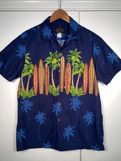 Hawaiian Reserve Collection shirt button down short sleeve. Awesome looking surfboard and palm trees themed shirt.   Size small (S) mens Made in Hawaii, USA 100% Cotton No Damage, no odor, clean.  Please message with any questions or for size measurements needed. All shirts are packed and shipped with quality materials. Retro Blue Button-up Hawaiian Shirt, Tropical Cotton Button-up Hawaiian Shirt, Button-up Hawaiian Shirt With Palm Tree Print For Beach, Multicolor Hawaiian Relaxed Fit T-shirt, Hawaiian Short Sleeve T-shirt With Palm Tree Print, Aloha Shirt, Mens Oxfords, Short Sleeve Shirt, Button Downs