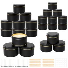 black candles with gold trims are arranged on top of each other and surrounded by pins