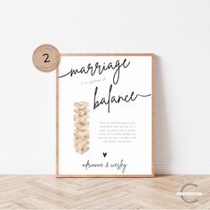 a poster with the words marriage balance in black ink on it next to a wooden frame