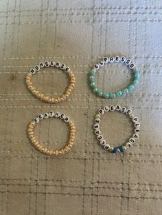 Four popular Sabrina Carpenter songs on bracelets Sabrina Carpenter Clay Bead Bracelet, Bracelet Ideas Sabrina Carpenter, Inspirational Multicolor Bracelet Jewelry, Inspirational Multicolor Bracelet, Sabrina Carpenter Bracelet Ideas, Sabrina Carpenter Bracelets, Friendship Bracelets Aesthetic, Song Bracelets, Sabrina Carpenter Songs