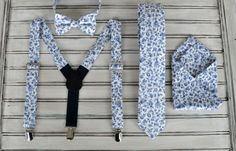 Outfit your wedding party, or just yourself for anytime.... Choose from the drop down menu: Skinny tie, Pocket Square Bow tie and Suspender set, Bow Tie, or Regular tie. This fabric is a super nice blue and cream floral cotton. The ties and suspenders are double lined to give them lots of body.  I hand make this item and they are ready to ship in 1 day. They are for all sizes from 6 months to adult. The suspenders are adjustable and have a little stretch on the back side so they will stay on ... Blue Floral Tie, Suspenders For Men, Aquarium Wedding, Groomsmen Ties, Bowtie And Suspenders, Floral Bow Tie, Suspenders Set, Tie Gifts, Tie Shop