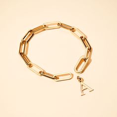 Stylish and chic, add a personalized charm of your choice to this bracelet by using the hinged link. To finish add a sweet hand-engraved message to your chosen charm to make this piece the perfect personalized gift.Available in 18K Champagne Gold PlatedChain length & style: 7 Hinged BraceletSecure clasp fasteningCharms can be added and removed from this chain and can be worn on all Merci Maman chain lengthsSent with love in a complimentary gift box Gift Link Chain Bracelet, Personalized 14k Gold Link Jewelry, Personalized 14k Gold Oval Link Jewelry, Gold Jewelry With Charms And Rectangular Links, Personalized Yellow Gold Oval Link Jewelry, Personalized Chain Link Jewelry Gift, Personalized Oval Link Minimalist Jewelry, Modern Gold Name Bracelet For Personalized Gift, Modern Gold Name Bracelet As Personalized Gift