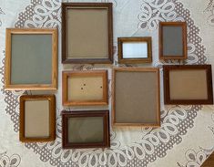 there are many frames on the table with one empty piece in front of them,