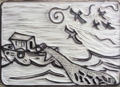 a ceramic tile with a boat on the water