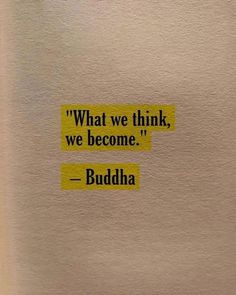 a piece of paper with the words buddha written on it in yellow and black ink