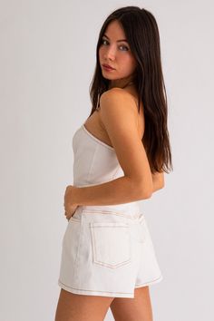 An exclusive, limited edition white denim tube style romper in white awaits. Model sizing: True to size but if you are in-between sizes, we recommend sizing up. Model is wearing a size small. Height: 5'8" Bust: 32A Waist: 24" Hips: 34" Fabric content: 98% Cotton, 2% Spandex White Denim Romper, Athleisure Tops, Silk Bottoms, High Waisted Jean Shorts, Shoes Heels Wedges, Leggings Sale, Denim Romper, Shoulder Crop Top, Plus Dresses