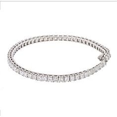 Indulge in the timeless elegance of our 14K White Gold 7 Carat Princess Cut One Line Tennis Bracelet. This exquisite piece is meticulously crafted in 14K white gold and adorned with a dazzling array of 7.70 carats of princess cut diamonds. Every diamond is carefully selected for its exceptional brilliance and fire, creating a captivating sparkle that will mesmerize onlookers.Designed to be worn effortlessly from day to night, this tennis bracelet is 7 inches long, draping gracefully around your White Platinum Diamond Bracelet With Accents, Exquisite Platinum Diamond Bracelet With Brilliant Cut, Exquisite Platinum Tennis Bracelet With Diamond Accents, Luxury Platinum Diamond Bracelet With Brilliant Cut, White Platinum Diamond Jubilee Bracelet, White Platinum Jubilee Diamond Bracelet, Timeless White Bracelets With Single Cut Diamonds, Dazzling Platinum Tennis Bracelet With Jubilee Style, Luxury Platinum Tennis Bracelet With Single Cut Diamonds