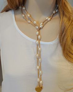 Pearl and leather necklace made with over 30 freshwater pearls in a soft blush color. SusanAfter60 mentions this in her blog post Warm Weather Styling Tips. With blush being such a fashionable color, this is wonderful against a white blouse! One long strand of tan leather to wrap several different ways for any neckline. Photos show many ways to wear this. Video demonstrates how to! The charm on the end of the leather is blank however you may change out for an engraved charm to personalize it for Pearl Lariat Necklace, Pearl Lariat, Leather Engraving, Jewelry Pearl, Pearl Leather, Letter Charms, Blush Color, Lariat Necklace, Styling Tips