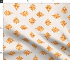 an orange and white leaf pattern is shown on the side of a wallpaper paper