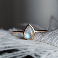 Pear Shaped Moonstone Engagement Ring Rose Gold Bezel Set Simple Wedding 925 Sterling Silver  Ring moonstone Modern Promise Anniversary Ring Looking for something to calm you down and bring more positivity and abundance in your life? Adorning yourself in moonstone would help! And what better way to wear moonstone jewelry than wearing it in a form a beautiful ring - with a modern design, our ring will bring a calming energy in no time. Gemstone: Natural Rainbow Moonstone Base Metal: Sterling Silver (925) Plating: 18k Gold Vermeil . Natural Moonstone stone cannot be always the same, gemstone color may change in different light/background condition. Thanks. Moonstone Engagement Ring Rose Gold, Rose Gold Plated Ring, Moonstone Ring Sterling Silver, Engagement Ring Rose Gold, Moonstone Engagement, Zierlicher Ring, Moonstone Engagement Ring, Rose Engagement Ring, Moonstone Jewelry