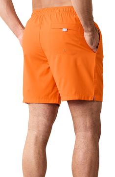 Take a refreshing dip in these sunny-day swim trunks designed with mechanical-stretch fabric, handy pockets and a comfy drawstring waist. 6 1/2" inseam; 24" leg opening; 12 1/2" front rise; 16" back rise (size Medium) Elastic/drawstring waist Side-seam pockets; back reverse-welt pocket Moisture-wicking fabric engineered for dryness and comfort UPF 30 sun protection Mesh liner 100% recycled polyester Machine wash, tumble dry Imported Nylon Swimwear With Built-in Shorts And Relaxed Fit, Orange Swim Trunks With Built-in Shorts For Beach, Beachwear Swimwear With Built-in Shorts For Outdoor, Stretch Swimwear With Pockets For Beach, Relaxed Fit Swim Trunks With Elastic Waistband For Outdoor, Travel Shorts With Built-in Liner For Summer, Orange Beachwear Swimwear With Built-in Shorts, Summer Nylon Swim Trunks With Pockets, Relaxed Fit Nylon Swim Trunks With Side Pockets