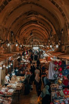 an indoor market filled with lots of people