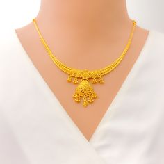 This exquisite 22k gold necklace set, weighing 22.2 grams, features a priceless floral charm design that exudes elegance and grace. The yellow gold finish enhances its radiant appeal, making it perfect for any special occasion. The necklace has a length of 16 inches, with a 1.1-inch drop length and adjustable 0.5-inch links for a customizable fit, secured by a hook lock. The set includes matching earrings, each measuring 1.25 inches in length with screw-back posts for secure and comfortable wear Gold-plated Yellow Necklaces With Intricate Design, Yellow Gold Plated Necklaces With Intricate Design, Yellow Gold-plated Necklaces With Intricate Design, 22k Yellow Gold Necklaces For Diwali, 22k Gold Yellow Necklaces For Wedding, 22k Gold Hallmarked Necklace For Diwali, Yellow Gold 22k Necklace For Diwali, 22k Gold Yellow Necklace For Wedding, 22k Yellow Gold Necklace For Diwali