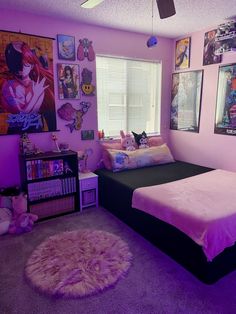 a bedroom with pink walls and posters on the wall