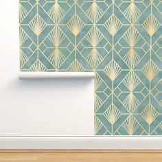 the wall paper is designed to look like an art deco design with gold and green accents