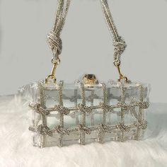 • Fashionable Design :The Rhinestone Purse Hand Bag is a trendy accessory for 2024, perfect for adding a touch of elegance to any outfit. • Versatile Usage :Ideal for parties, this bag offers a versatile and stylish accessory that can enhance your look. • Durable Material :Made from Acrylic, this bag is hard and durable, ensuring long-lasting use. • No Pockets :The interior of this bag is solid without pockets, keeping it simple and chic. • Embellished Decoration :Adorned with diamonds, this bag adds a touch of glamour to your ensemble. • Easy Closure :Featuring a hasp closure, this bag is easy to open and close, ensuring secure storage. Size: Length:20cm(7.87inch) width: 7cm(2.76 inch) Height: 10cm (3.94inch)Manual measurement with 1-3cm errorFabric: Acrylic Tip: Dear buyer friends, our s Chic Bags With Rhinestones For Fashion Accessory, Chic Rhinestone Bags For Fashion Accessory, Glamorous Square Shoulder Bag, Trendy Rhinestone Clutch Shoulder Bag, Trendy Rhinestone Shoulder Bag For Formal Occasions, Trendy Formal Shoulder Bag With Rhinestones, Trendy Rectangular Shoulder Bag With Rhinestones, Trendy Rhinestone Clutch Bag, Chic Embellished Rectangular Shoulder Bag