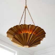 a chandelier hanging from the ceiling in a room with white walls and windows