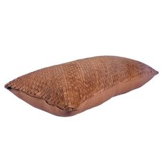 a brown pillow on a white background