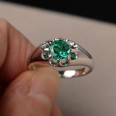 This is a gorgeous handmade creation. Its beauty is its simplicity & Elegance. The 6*6mm round shape faceted lab emerald is crafted in solid sterling silver and with rhodium plated. All item is sent in a beautiful gift box If you have any idea of design your ring,pls contact me directly. You can realize more lovely stuff clicking the link https://www.etsy.com/shop/knightjewelry?refshopsection_shophome_leftnav Please leave the correct address and you phone number for delivering successfully. Sterling Silver Emerald Ring With Halo For Promise, Green Solitaire Crystal Ring In Sterling Silver, Solitaire Round Emerald Ring For Promise, Emerald Birthstone Ring In White Gold, Round Cut, Sterling Silver Emerald Ring With Center Stone, Sterling Silver Emerald Ring With Round Stone, Emerald Birthstone Ring In White Gold, Round Solitaire Emerald Promise Ring, Emerald Ring With Round Shape