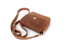 Women's handmade genuine leather shoulder bag, leather purse for wonderful travel, crossbody bag for pleasant evening walks. The stylish and elegant bag has a smooth, flat surface, very comfortable and soft. ✅PERSONALIZATION: You can add free stamp initials, an example of which you can see in the printout photos. If you are interested in engraving a picture or a quote with a name, email me and we will discuss in detail. ✅FEATURES: - Size: 7x 6.3x 2 inches - Size straps: 44 inches - Bag weight 0. Leather Square Flap Bag With Phone Holder, Square Leather Pouch With Removable Pouch, Brown Square Flap Bag For Gift, Brown Satchel Bag For Personal Use, Square Leather Flap Bag As A Gift, Leather Crossbody Shoulder Bag For Personal Use, Leather Shoulder Bag With Removable Pouch For Personal Use, Brown Crossbody Shoulder Bag For Personal Use, Brown Satchel Bag