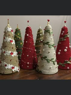 several small christmas trees made out of rope