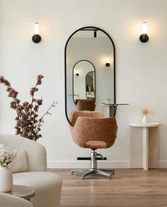 a chair and mirror in a room