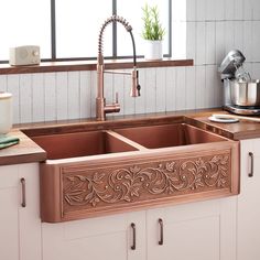 a kitchen sink with an intricate design on the side