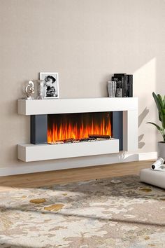 This is an elegant piece of heating appliance. The appearance is designed in a minimal way, with the white wooden frame, the simple appearance can add a touch of contemporary to any room. You deserve a cosy winter, and this fireplace provides you with constant heat yet without bringing any smoke or odor. Heat up your room in style with this fireplace! Electronic Fireplace Ideas, Surround Fireplace, House Refurbishment, Electric Fire Suites, Electric Fireplace Wall, Recessed Electric Fireplace, Fireplace Suites, Black Fireplace, Hotel Lobbies