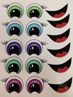 an assortment of different colored eyes on a white sheet with black and red circles around them