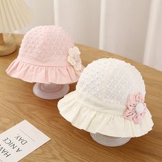 Charming Sun Protection for Your Little One Keep your baby girl safe and stylish with our Sweet Cute Baby Bucket Hat. This delightful sun hat is perfect for protecting your little one's delicate skin from harmful UV rays while adding a touch of charm to her outfit. Made from a blend of soft cotton and durable polyester, this hat is designed to provide comfort and breathability, making it ideal for sunny days spent outdoors. Features Our baby sun hat is designed with both functionality and style in mind. Here are some key features: Material: Soft and breathable cotton and polyester blend Color Options: Available in Pink, Yellow, and White Size: Fits babies with a head circumference of 17.3-18.9 inches (44-48 cm), suitable for ages 3-18 months Design: Adorable lace ruffle and flower detailin Adjustable White Sun Hat For Playtime, White Summer Sun Hat For Playtime, Cute Spring Bucket Hat For Playtime, White Sun Hat With Uv Protection For Playtime, White Floral Shaped Sun Hat For Summer, White Flower Sun Hat For Vacation, White Flower Shaped Sun Hat For Summer, White Flower-shaped Sun Hat For Summer, Cute Spring Sun Hat For Playtime