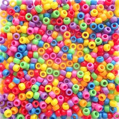 multicolored plastic beads are arranged in a square pattern