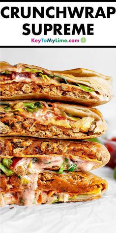 a stack of sandwiches sitting on top of each other with the words crunchwrap supreme