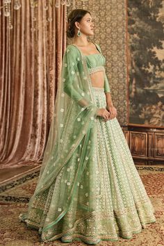 Spring green attached cancan lehenga with thread, lace embroidery in geometric pattern. Paired with pleated border embroidered padded blouse and dupatta. - Aza Fashions Elegant Green Lehenga With Resham Embroidery, Elegant Green Lehenga With Sheer Dupatta, Fitted Pista Green Anarkali Set With Intricate Embroidery, Elegant Pista Green Organza Choli, Green Organza Choli With Intricate Embroidery, Elegant Green Lehenga With Intricate Embroidery, Fitted Green Anarkali Set With Intricate Embroidery, Elegant Green Choli With Sheer Dupatta, Elegant Green Choli With Intricate Embroidery