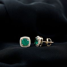 Product Details Experience the enchantment of these captivating Stud Earrings, showcasing a Round Shape Lab Created Emerald at the center, delicately held in a Prong Setting. Surrounding the vibrant created emerald is a dazzling Halo of Moissanite gemstones, adding an extra touch of sparkle. With the inclusion of a Screw Back Closure, these halo earrings ensure a secure fit, providing peace of mind. Whether for a special occasion or everyday wear, these beautiful earrings are guaranteed to elici Green Diamond Earrings With Prong Setting, Gia Certified Green Diamond Earrings For Anniversary, Green Halo Design Fine Jewelry Earrings, Green Halo Diamond Earrings For Anniversary, Green Diamond Halo Design Earrings, Diamond Halo Earrings For May Birthstone, Green Diamond Earrings With Halo Design For Anniversary, Diamond Halo Setting Earrings For May Birthstone, Green Halo Setting Earrings For Anniversary