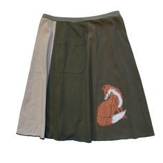 "Classic Appliqué skirts are made with high quality, up-cycled t-shirts. Freestyle sewn images are appliquéd on panels of various colors making each skirt unique and interesting.  Each skirt has a convenient pocket. Since there is no real \"front\" or \"back\"of this skirt, simply place the pocket where you like. The 21\" length, a-line cut, elastic waist and up-cycled knit fabric create an ultra comfortable skirt that will be your best friend all year long. EACH SKIRT IS MADE TO ORDER AND UNIQU Casual Reworked Summer Skirt, Cotton Patchwork Mini Skirt, Casual Cotton Skirt With Upcycled Details, Casual Cotton Upcycled Skirt, Casual Upcycled Cotton Skirt, Upcycled Cotton Summer Skirt, Fitted Cotton Patchwork Skirt, Fitted Cotton Skirt With Reworked Details, Retro Cotton Patchwork Skirt